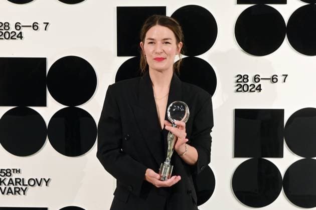 Norwegian actress Helga Guren poses in front the photo wall with her Best Actress Award after the closing awards ceremony of the 58th Karlovy Vary International Film Festival, in Karlovy Vary, Czech Republic, on July 6, 2024. (CTKxPhoto SlavomirxKubes) CTKPhotoP2024070605584  CTKPhotoP2024070605584