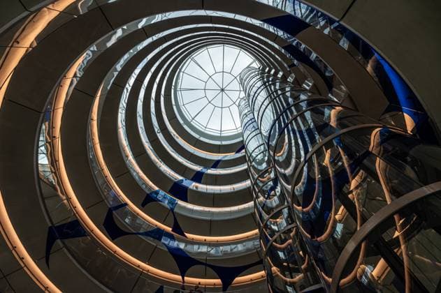 Creative Highlights World Brussels old town, Belgium - July 4, 2024 - Swirling staircase and elevator of the Brucity administrative building