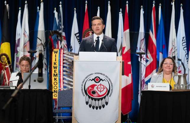July 11, 2024, Montreal, Pq, Canada: Federal Conservative Leader Pierre Poilievre speaks to the Assembly of First Nations as National Chief Cindy Woodhouse Nepinak, right, looks on, Thursday, July 11, 2024 in Montreal. Montreal Canada  - ZUMAc35_ 20240711_zaf_c35_005 Copyright: xRyanxRemiorzx