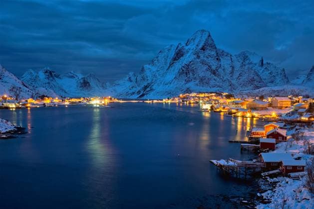 Reine village illuminated at night. Lofoten islands, Norway. Reine village at night. Lofoten islands, Norway ,model released, Symbolfoto
