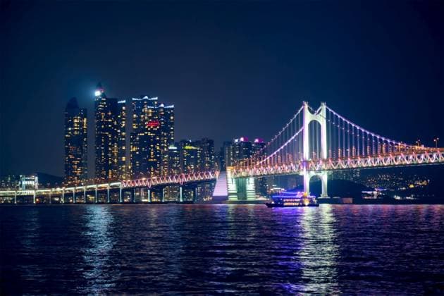 Gwangan Bridge and skyscrapers illuminated in the night. Busan, South Korea. Gwangan Bridge and skyscrapers in the night. Busan, South Korea ,model released, Symbolfoto