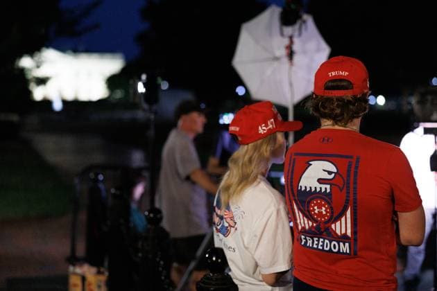 People Gather Near White House Following Trump Assassination Attempt In Pennsylvania Two people wearing Trump hats gather outside of Lafayette Park near the White House in Washington, D.C. on July 13, 2024 after it was reported that there was an assassination attempt on former President Donald Trump during a rally in Butler, Pennsylvania. The United States Secret Service closed Lafayette Park and Pennsylvania Avenue to the public following the shooting in Pennsylvania. Washington, D.C. District of Columbia United States  Copyright: xBryanxOlinxDozierx originalFilename: dozier-peoplega240713_npDHF.jpg