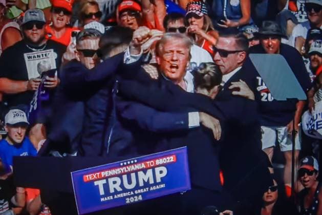 July 14, 2024, Butler, Pennsylvania, United States: In this photo illustration, a screen shows Former US President Donald Trump shot in the ear at a rally he was holding in Butler. Former US President Donald Trump was wounded in a shooting at a rally he was holding in Butler, Pennsylvania as part of his election campaign ahead of the 2024 US Presidential election. According to the latest reports, secret agents killed a shooter and one rally participant died at the hands of the shooter himself, the shooting at the rally is being investigated as an attempted assassination of former President Trump, the Associated Press reports, citing the Butler County District Attorney. Butler United States - ZUMAs197 20240714_aaa_s197_003 Copyright: xArtemxPriakhinx