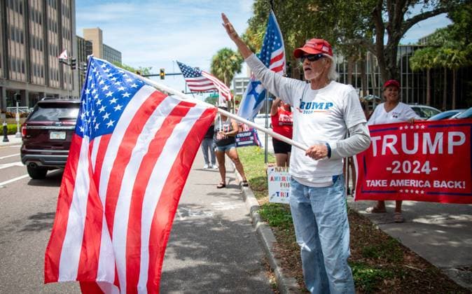 July 14, 2024, Florida, USA: A group waves flags and signs in support of former President Donald Trump along Court Street Sunday, July 14, 2024 in Clearwater. USA - ZUMAs70_ 20240714_zan_s70_003 Copyright: xDylanxTownsendx