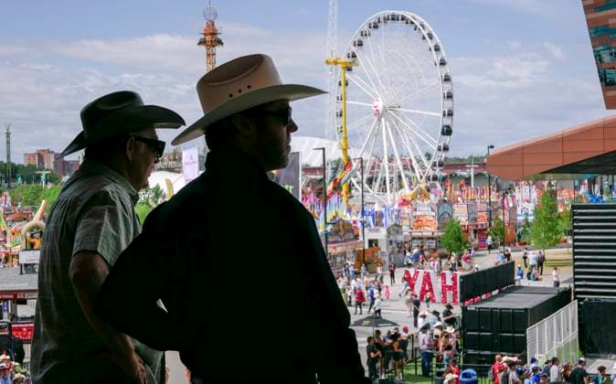 July 14, 2024, Calgary, Ab, CANADA: Visitors take in the view during the final day of the Calgary Stampede in Calgary, Sunday, July 14, 2024. Calgary CANADA  - ZUMAc35_ 20240714_zaf_c35_014 Copyright: xJeffxMcintoshx
