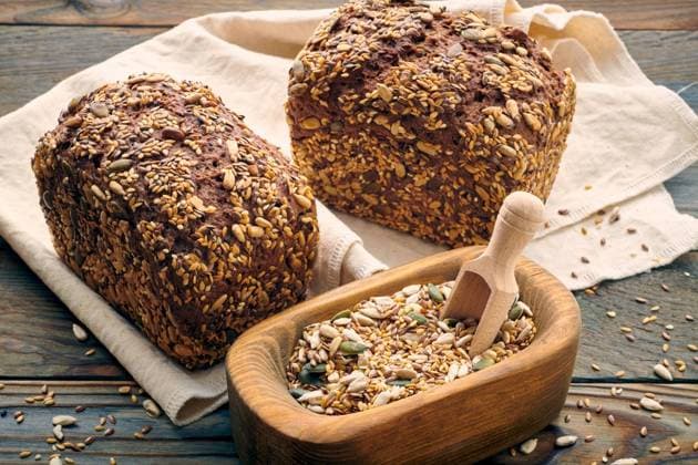 Freshly baked homemade bread on dark wooden table ,model released, Symbolfoto
