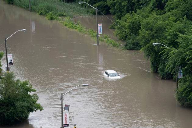 July 16, 2024, Toronto, On, Canada: A car is partially submerged in flood waters in the Don Valley following heavy rain in Toronto, on Tuesday, July 16 2024. Toronto Canada  - ZUMAc35_ 20240716_zaf_c35_077 Copyright: xArlynxMcadoreyx