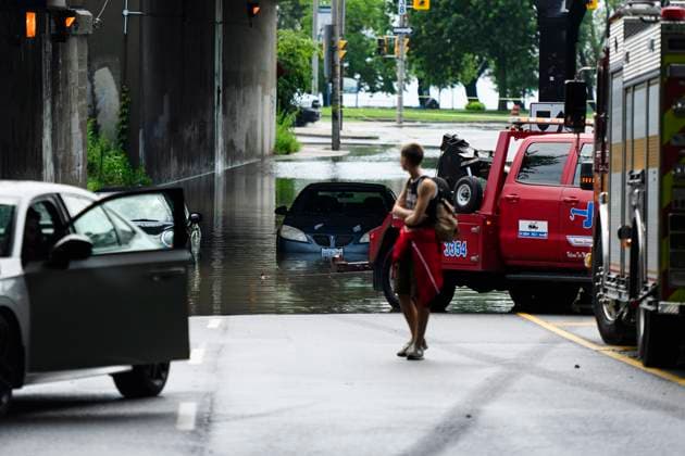 July 16, 2024, Toronto, On, Canada: Emergency services respond to submerged vehicles at an underpass at Parkside Drive and Lake Shore Blvd., after heavy rain caused flooding, in Toronto on Tuesday, July 16, 2024. Toronto Canada  - ZUMAc35_ 20240716_zaf_c35_109 Copyright: xChristopherxKatsarovx