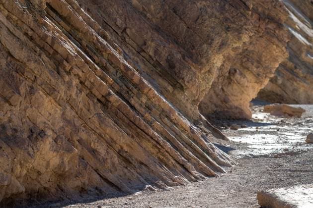 Creative Highlights World A rocky cliff with a lot of cracks and crevices Death Valley Junction, California, United States R_YECJHG240716-1488744-01