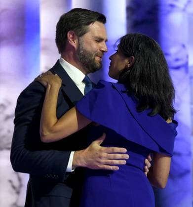 July 17, 2024, Milwaukee, Wisconsin, USA: Ohio Senator JD VANCE embraces his wife USHA CHILUKURI VANCE, who introduced him, as he accepts the Republican nomination for vice president on the third day of the Republican National Convention at Fiserv Forum in Milwaukee, Wisconsin Wednesday July 17, 2024. Milwaukee USA - ZUMAh154 20240717_znp_h154_015 Copyright: xMarkxHertzbergx