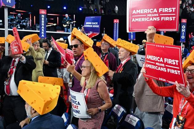 Delegates from Wisconsin wear cheese hats and hold signs during the 2024 Republican National Convention at Fiserv Forum in Milwaukee, Wisconsin on Thursday, July 18, 2024. The theme of the final day is Make America Great Once Again, with former President Donald Trump as the featured speaker.  MIL20240718301 MATTxMARTON