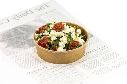 IMAGO Creative, Food, Trend, Meal Prep A healthy salad with roasted tomatoes and feta cheese in a brown paper bowl 25056783 RECORD DATE NOT STATED