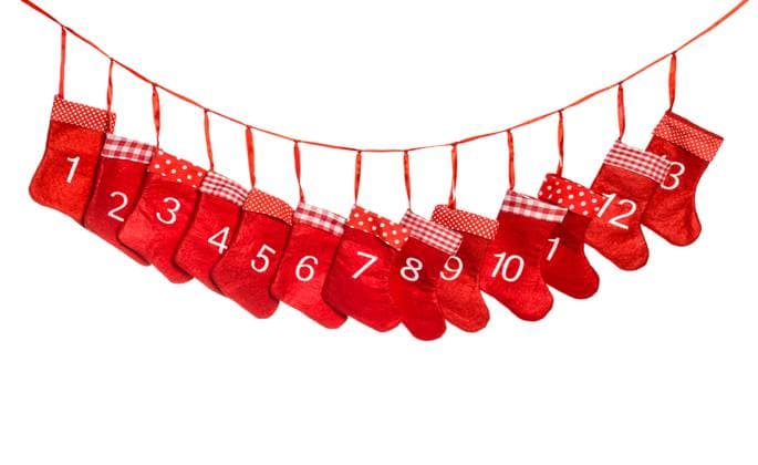 Advent calendar. Christmas decoration red stocking isolated on white background ,model released, Symbolfoto