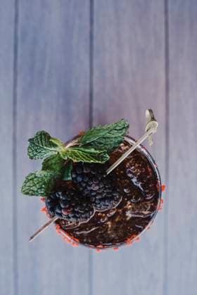 Refreshing blackberry cocktail with mint garnish. San Diego, California, United States R_QCYJ240711-1469489-01