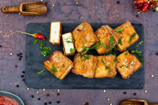 Roasted tofu cheese,asian vegan food. Tasty tofu cheese roasted with sesame ,model released, Symbolfoto