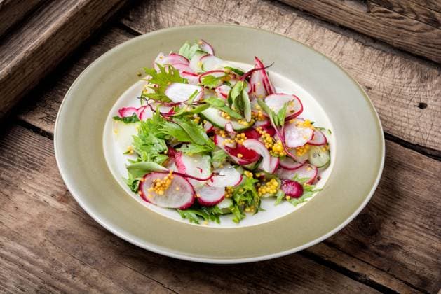 Healthy salad made from sliced radish.Healthy vegan food. Salad of radish and green ,model released, Symbolfoto