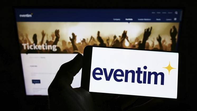 Stuttgart, Germany, 05-21-2022: Person holding smartphone with logo of German ticketing company CTS Eventim AG Co. KGaA on screen in front of website. Focus on phone display, Europe Copyright: imageBROKER TimonxSchneider ibliqx10688291.jpg