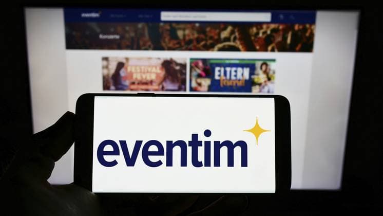 Stuttgart, Germany, 05-21-2022: Person holding cellphone with logo of German ticketing company CTS Eventim AG Co. KGaA on screen in front of webpage. Focus on phone display, Europe Copyright: imageBROKER TimonxSchneider ibliqx10688297.jpg