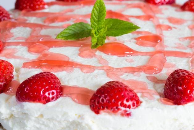 Cake Strawberry cream cheese on blue timber.. Cake Strawberry cream cheese on blue timber ,model released, Symbolfoto