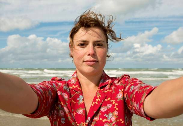 Creative Highlights Symbolfotos Smiling mature woman taking selfie at beach on sunny day model released, Symbolfoto, MKJF00933