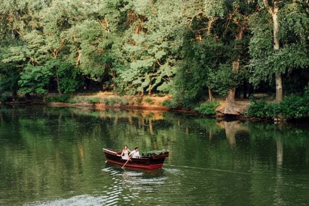 a boat trip for a guy and a girl along the canals and bays of the river overgrown with wild willows ,model released, Symbolfoto