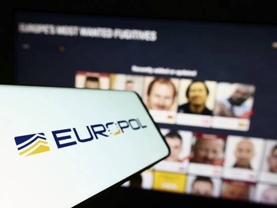 Stuttgart, Germany, 04-02-2023: Cellphone with logo of EU law enforcement agency Europol on screen in front of website. Focus on left of phone display, Europe *** Stuttgart, Germany, 04 02 2023 cellphone With Logo of EU Law Enforcement Agency Europol ON Screen in Front of Website Focus ON left of Phone display, Europe Copyright: imageBROKER TimonxSchneider ibliqx10709313.jpg