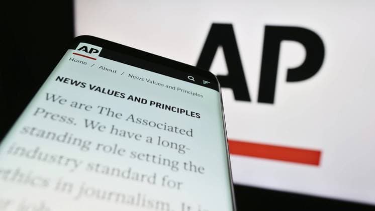 Stuttgart, Germany, 07-11-2023: Mobile phone with website of US news agency Associated Press (AP) on screen in front of logo. Focus on top-left of phone display, Europe Copyright: imageBROKER TimonxSchneider ibliqx10714829.jpg