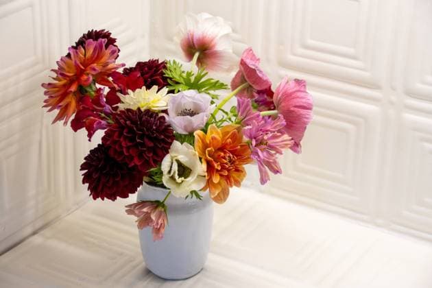 Colorful flower bouquet in a white vintage jug Kelowna, British Columbia, Canada R_PESF240726-1490941-01