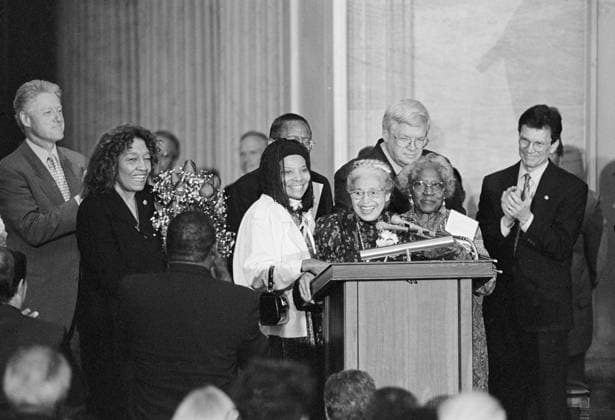 ROSA PARKS (1913-2005). American civil rights activist. Receiving the Congressional Gold Medal at a ceremony in Washington, D.C. Parks is flanked by assistant Elaine Steele and civil rights leader Julia Carson as President Bill Clinton and others applaud. Photograph by Rebecca Roth, 15 June 1999.  Copyright: xGRANGERx xGRANGERx 0646996