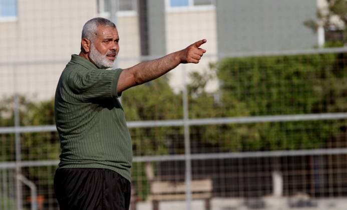 (FILES) Senior leader of Hamas Ismail Haniyeh participates in football match in solidarity with prisoners on hunger strike held in Israeli jails in Gaza city, on June 7, 2014. Some 120 Palestinians jailed without trial in Israel have been on an open-ended hunger strike, eating only salt and drinking water, since April 24 to demand an end to so-called administrative detention .Iran s Revolutionary Guards said July 31, 2024 that the chief of the Palestinian Hamas militant group, Ismail Haniyeh, was killed in Tehran along with one of his bodyguards. Photo by Ramadan ALagha Gaza city Gaza Strip Palestinian Territory 310724_Archive_Haniyeh_00(68) Copyright: xapaimagesxRamadanxALaghax xapaimagesx