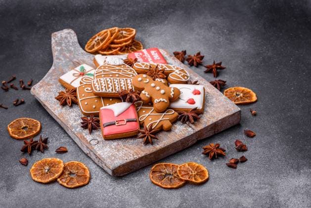 Beautiful delicious sweet winter Christmas gingerbread cookies on a gray textured background. Preparing for a family holiday Beautiful delicious sweet winter Christmas gingerbread cookies on a gray textured background. Preparing for a family holiday Copyright: xZoonar.com TetianaxChernykovax 21696780