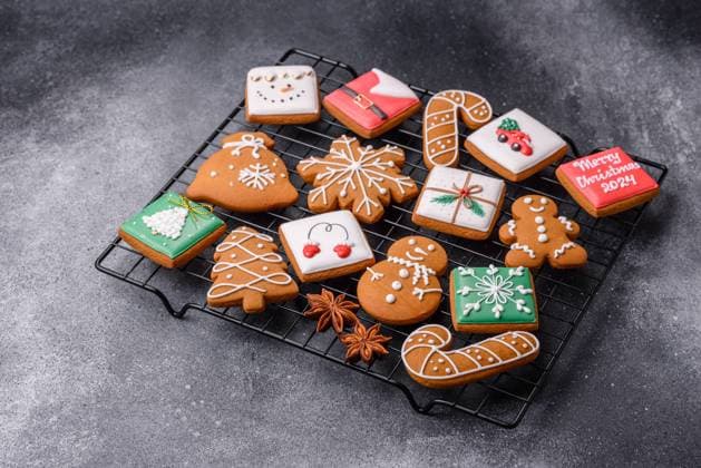 Beautiful delicious sweet winter Christmas gingerbread cookies on a gray textured background. Preparing for a family holiday Beautiful delicious sweet winter Christmas gingerbread cookies on a gray textured background. Preparing for a family holiday Copyright: xZoonar.com TetianaxChernykovax 21696957