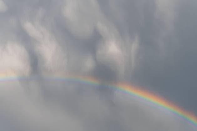 Rainbow appearing in rainy clouds in spring. Rainbow appearing in rainy clouds in spring. Bas Rhin, Alsace, France, Europe Copyright: xZoonar.com christianxdecoutx 21699329