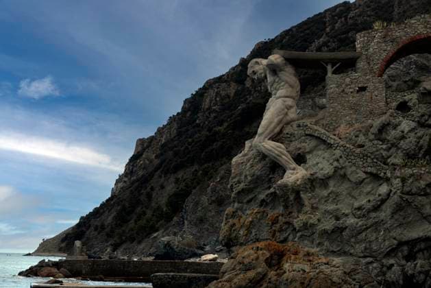 Il Gigante, a stone sculpture representing Neptune, Roman god of the sea, at the end of Fegina Beach, Monterosso al Mare, Cinque Terre, UNESCO World Heritage Site, Liguria, Italy, Europe. Copyright: fotojourneys 1231-81