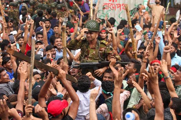 August 5, 2024, Dhaka, Dhaka, Bangladesh: Anti-government protestors celebrate in Dhaka on August 5, 2024. Protests in Bangladesh that began as student-led demonstrations against government hiring rules in July culminated on August 5, in the prime minister fleeing and the military announcing it would form an interim government. Dhaka Bangladesh - ZUMAj163 20240805_zip_j163_009 Copyright: xAbuxSufianxJewelx