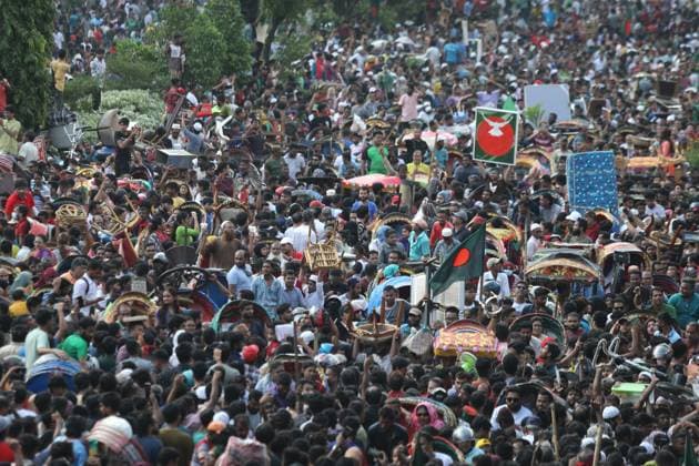 August 5, 2024, Dhaka, Wari, Bangladesh: Anti-government protestors celebrate in Shahbag near Dhaka university area in Dhaka on August 5, 2024. Protests in Bangladesh that began as student-led demonstrations against government hiring rules in July culminated on August 5, in the prime minister fleeing and the military announcing it would form an interim government.People gather to celebrate the fall of Bangladesh Prime Minister Sheikh Hasina after an intense clash between police, pro-government forces, and anti-Quota protesters in Dhaka, Bangladesh. Dhaka Bangladesh - ZUMAr336 20240805_zip_r336_039 Copyright: xHabiburxRahmanx