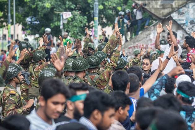 August 5, 2024, Dhaka, Bangladesh: Anti-government protestors celebrate with army personnel in Shahbag near Dhaka University area. Thousands of people are celebrating the resignation of Bangladeshi Prime Minister Sheikh Hasina..Protests in Bangladesh that began as student-led demonstrations against government hiring rules in July culminated on August 5, in the prime minister fleeing and the military announcing it would form an interim government. Dhaka Bangladesh - ZUMAs197 20240805_aaa_s197_080 Copyright: xSazzadxHossainx