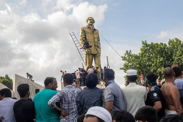 August 5, 2024, Dhaka, Bangladesh: Anti-government protestors march on the street during the celebrations. Thousands of people are celebrating the resignation of Bangladeshi Prime Minister Sheikh Hasina..Protests in Bangladesh that began as student-led demonstrations against government hiring rules in July culminated on August 5, in the prime minister fleeing and the military announcing it would form an interim government. Dhaka Bangladesh - ZUMAs197 20240805_aaa_s197_083 Copyright: xSazzadxHossainx