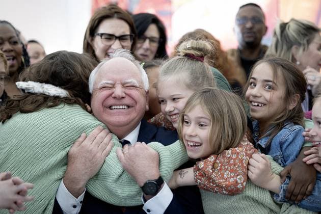 August 6, 2024, Minneapolis, MN, United States: Minnesota Governor Tim Walz gets a huge hug from students at Webster Elementary after he signed into law a bill that guarantees free school meals, (breakfast and lunch) for every student in Minnesota s public and charter schools in Minneapolis, on Friday, March 17, 2023. Minneapolis United States - ZUMAm67_ 20240806_zaf_m67_004 Copyright: xElizabethxFloresx