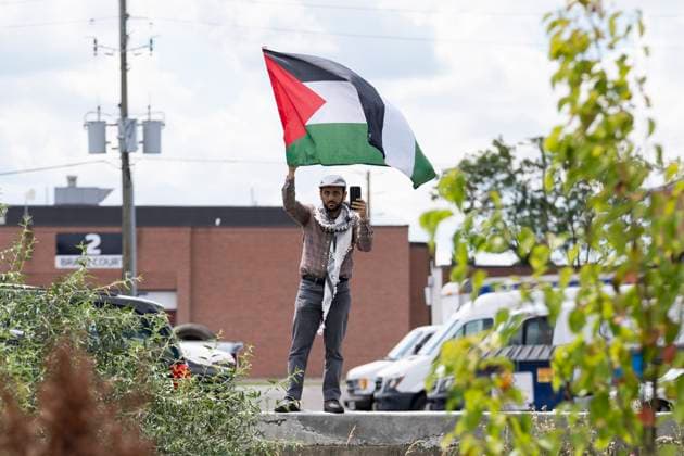 August 10, 2024, Brampton, On, Canada: A Pro Palestinian protester waves a flag outside of a Liberal Party Fundraising event in anticipation of the arrival of Prime Minister Justin Trudeau (not pictured) in Brampton, Ont., Saturday, August 10, 2024. Brampton Canada  - ZUMAc35_ 20240810_zaf_c35_171 Copyright: xArlynxMcadoreyx