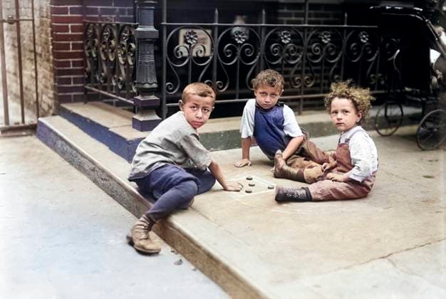 Three Young Boys playing Game on Sidewalk, New York City, New York, USA, Bain News Service, July 1913  Copyright: xCircaxImagesx ghi-circa02818