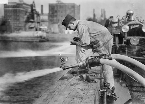 Fireman testing Fire Engine Hose, New York City, New York, USA, Bain News Service, September 1913  Copyright: xCircaxImagesx ghi-circa02821