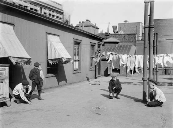 Children playing marbles on apartment building rooftop, New York City, New York, USA, Bain News Service, 1910  Copyright: xCircaxImagesx ghi-circa02907