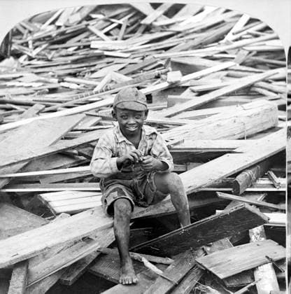 Portrait of young boy sitting on pile of debris after hurricane, Galveston, Texas, USA, Single Image of Stereo Card, 1900  Copyright: xCircaxImagesx ghi-circa03098