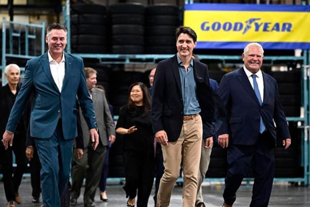 August 12, 2024, Napanee, On, CAN: Left to right, Mark Stewart, Chief Executive Officer and President of Goodyear, left, Prime Minister Justin Trudeau, and Premier of Ontario Doug Ford arrive for an announcement at the Goodyear plant in Napanee, Ont., on Monday, Aug. 12, 2024. Napanee CAN - ZUMAc35_ 20240812_zaf_c35_004 Copyright: xJustinxTangx