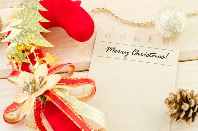 Merry Christmas word writing on brown paper. Merry Christmas word writing on brown paper with christmas decoration on wooden background. Copyright: xZoonar.com PENCHANx 8184284