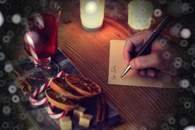 christmas hand writing story hand writing Christmas letter on the table ,model released, Symbolfoto Copyright: xZoonar.com AleksandrxKichiginx 9754266 ,model released, Symbolfoto ,property released
