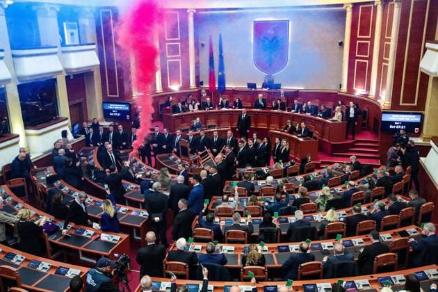 December 21, 2023, Tirana, Tirana, Albania: Parliament member of Albanian opposition Democratic Party smoke a flare during a session of Albanian Parliament as a sign of protest against the lift of the legal immunity to former Prime Minister Sali Berisha, who is being probed by the country prosecutors for possible corruption. Tirana Albania - ZUMAb266 20231221_zip_b266_001 Copyright: xArmandoxBabanix