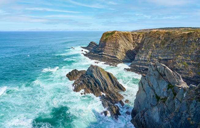Creative Highlights World Felsencliff an der Atlantikküste von Portugal land and seascape at the rocky coastline of the Atlantic Ocean near Porto Covo near Sines, Portugal, Europe Copyright: xZoonar.com UwexMoserx 21938449