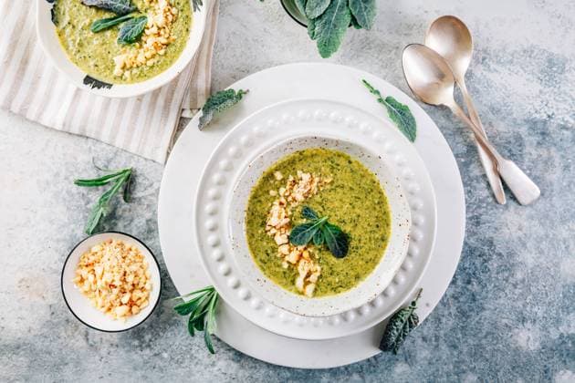 Green palm kale soup with roasted macadamia nuts Green palm kale soup with roasted macadamia nuts, vegan food Copyright: xZoonar.com IngridxBalabanovax 21941747